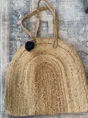 A Classy Chic Boutique Natural Straw Shoulder Bag with Black Flower Charm